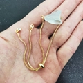 Adjustable 18K gold chain bracelet featuring an irregular light blue raw gemstone - Kyanite