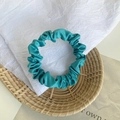 Elegant teal silk satin hair scrunchie with a pleated texture for women - Peacock Blue