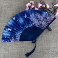 Dark blue folding fan with cherry blossom pattern, wooden ribs and elegant blue tassel - No.20 Dark Blue Cherry Blossom Butterfly
