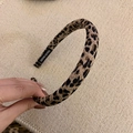 Detailed shot of a vintage leopard print slim headband with a handmade inner label - Light Leopard Headband (1.5cm)