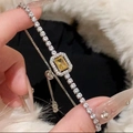 Macro detail of silver tennis bracelet with rectangle yellow stone and halo setting - 36# Silver Yellow Rectangular Style