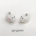 Macro view of 20x22mm white sheep charms with silver rings for DIY jewelry making - Little White Sheep