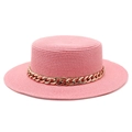 Detailed close-up of pink straw boater hat with stylish gold chain strap decoration - Dusky Pink