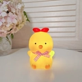 Cute yellow chick night light with a red comb and plaid bow tie on a white surface - Meow Chick - Yellow - Pink Ribbon