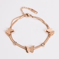 Detail of rose gold butterfly bracelet with frosted texture and double layer chain - Rose Gold