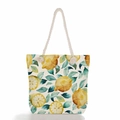 Close-up of lemon print canvas tote with thick rope handles and metallic eyelets - Watercolor Lemon Leaf Print (ms0647)