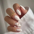 Close-up of almond-shaped white press-on nails with brown floral designs and gold details - Bright White Brown Floral (CW271)