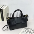 Matte black leather woven tote bag with large weave patterns and gold hardware detail - Black