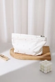 Close-up of heart embroidery on cream striped fabric cosmetic bag with brand label - Large / White