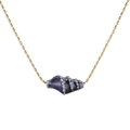 Detailed macro view of a golden bead chain and a blue spiral ceramic conch pendant - Sapphire Blue