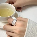 Silver wide band ring for women featuring a unique irregular textured surface on finger - JZ0077 (Irregular Texture)