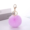 Detailed view of soft purple faux rabbit fur pompom with golden metal lobster clasp - Purple