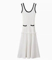 Detail of knit midi dress with black contrast trim, U-neck, and fishtail hemline - S / White