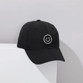 Detail of black quick-dry kids baseball cap with white smiley face embroidery and vent holes - 52-54cm / Smiley Face Black