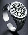 Macro shot of punk dragon claw ring featuring Tai Chi Yin Yang symbol and ancient coin carving - Style 11