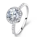 Elegant silver ring featuring a large round blue zircon with halo diamond setting - US 5 / White Gold Halo Luxury Style