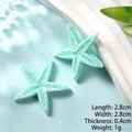 Macro view of light blue resin starfish charms with texture for DIY hair accessories - Blue Thin Starfish