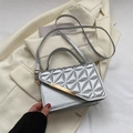Silver quilted shoulder bag with gold metal trim and elegant top handle for women - Silver