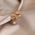Elegant golden ginkgo leaf brooch with white pearl accents on champagne silk background - 557# Bank Trust