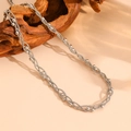 Close-up of silver multilayer braided beaded necklace on a rustic driftwood branch - I714 Round Snake Beaded Steel Necklace