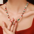 Christmas necklace with red white green beads and golden bell charm on neck - D1216 Single Layer Beaded Golden Bell Pendant