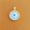 Golden Evil Eye pendant with blue zircon inlay on orange leather background - 24-Gold Round Zircon Blue Eye Beads