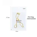Golden carbon steel eyelash curler with black rubber pad in a clear PVC pouch - Gold Plated (PVC Bag)