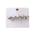 Silver spring hair clip featuring five stars on white card for elegant hair styling - Silver Liquid Star