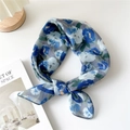 Blue and white floral cotton linen square scarf tied in a knot on a white background - 29 Cotton - Hibiscus Blue