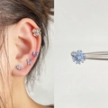Blue zircon flower and butterfly stainless steel stud earrings set on a female model - EGD58 Light Blue Opal Flower