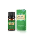 Pure cedar essential oil in 10ml amber bottle with green packaging box for aromatherapy - Cedarwood Oil