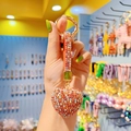 Sparkling orange-red rhinestone heart keychain with matching crystal strap and gold ring - Mixed Red Heart