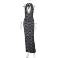 Detailed view of the intricate floral lace texture and plunging V-neck on a black dress - S / Black