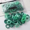 Set of high elasticity seamless hair ties in shades of green with a frosted zipper bag - 100 Pieces Set / Green System