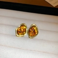 Macro view of geometric amber resin studs with irregular polished gold-plated frames - 8# Silver Earring Post-Gold-Brown-Irregular Freeform