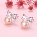 Eleganti orecchini a fiocco con perle rosa a cuore e accenti in zircone trasparente - Perno in Argento S925 / Perla Rosa / Perla Rosa