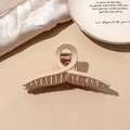 Close-up of matte beige claw clip showing its smooth texture and spring mechanism - Beige Matte-Cross