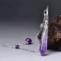 Macro detail of natural amethyst hexagonal pendant with ornate silver filigree cap - Silver Amethyst