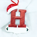 Glittery red Christmas letter H ornament with Santa hat and holly leaves hanging decoration - Letter H