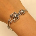 Detail view of retro silver punk skull bracelet on wrist showing gothic alloy bone links - 05 Ancient Silver 2764 (1 Skeleton)