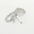 Detailed view of silver bow hair clip featuring a woven texture and metallic finish - Silver