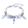 Silver alloy charm bracelet with clear beads, heart pendants, key, and rose flower charms - White