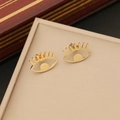Detail of gold evil eye stud earrings with cubic zirconia in a jewelry box - 3# Eye Shape Stud Earrings / Gold