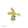 Macro shot of gold charm dangle with travel motifs: camera, suitcase and airplane charms - Camera/Suitcase/Airplane