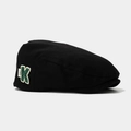 Detail of black cotton beret featuring a 3D green letter K logo and white woven tag - 52cm (2-5 Years) / Black