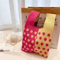Knitted tote bag with vibrant rose red and yellow color block and large polka dot pattern - Rose Red