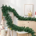 Lush green artificial Christmas flocked garland draped over stairs and wooden tables - 1.8m/6FT Non-flocked (133 Heads)