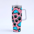 Detail of pink 40oz tumbler with black and blue paw prints, lid and reusable straw - R165 / 40oz