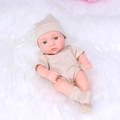 Realistic 20cm reborn baby doll in beige striped outfit on a soft white plush rug - Striped Coffee