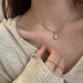 Detail of silver heart pendant necklace with clip chain and sparkling zircon rings - Asymmetric Chain Heart Necklace
